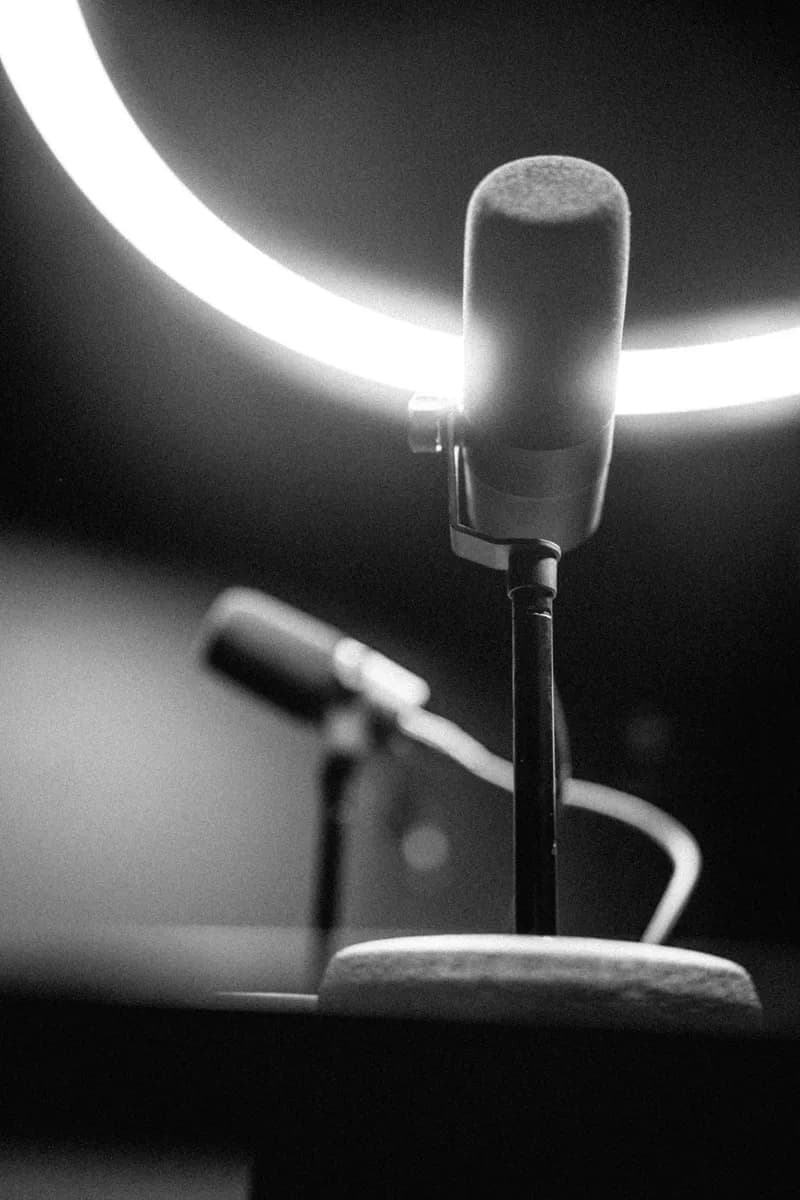 Podcast microphones under the halo light in The Round Table